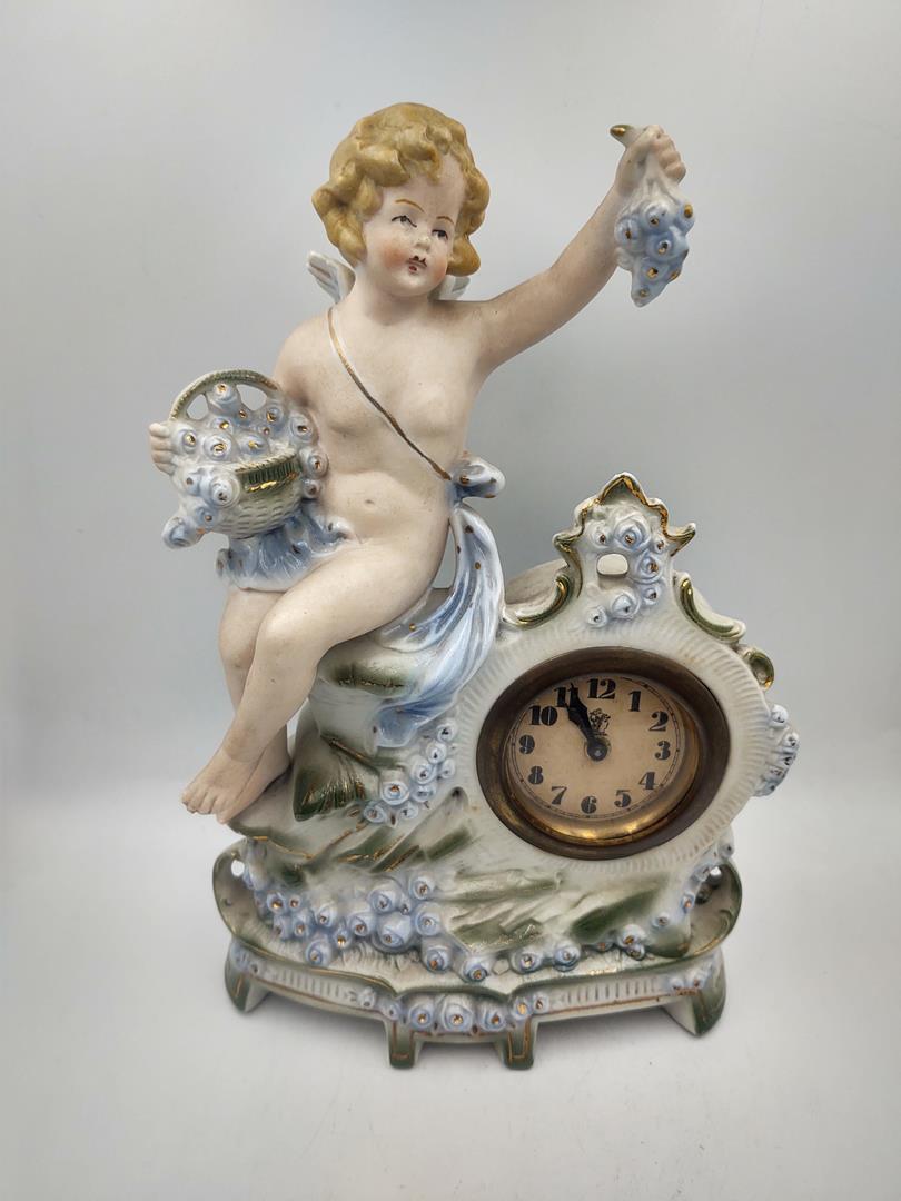 Zegar porcelanowy figuralny